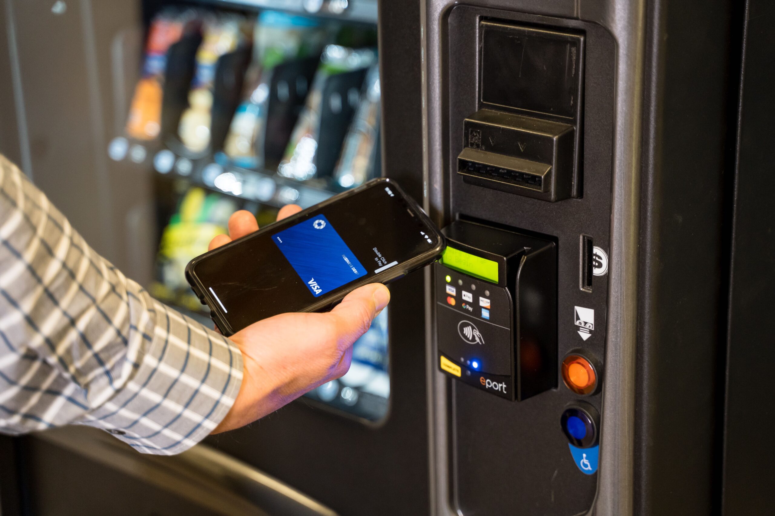 Customer using mobile payment at a smart cooler