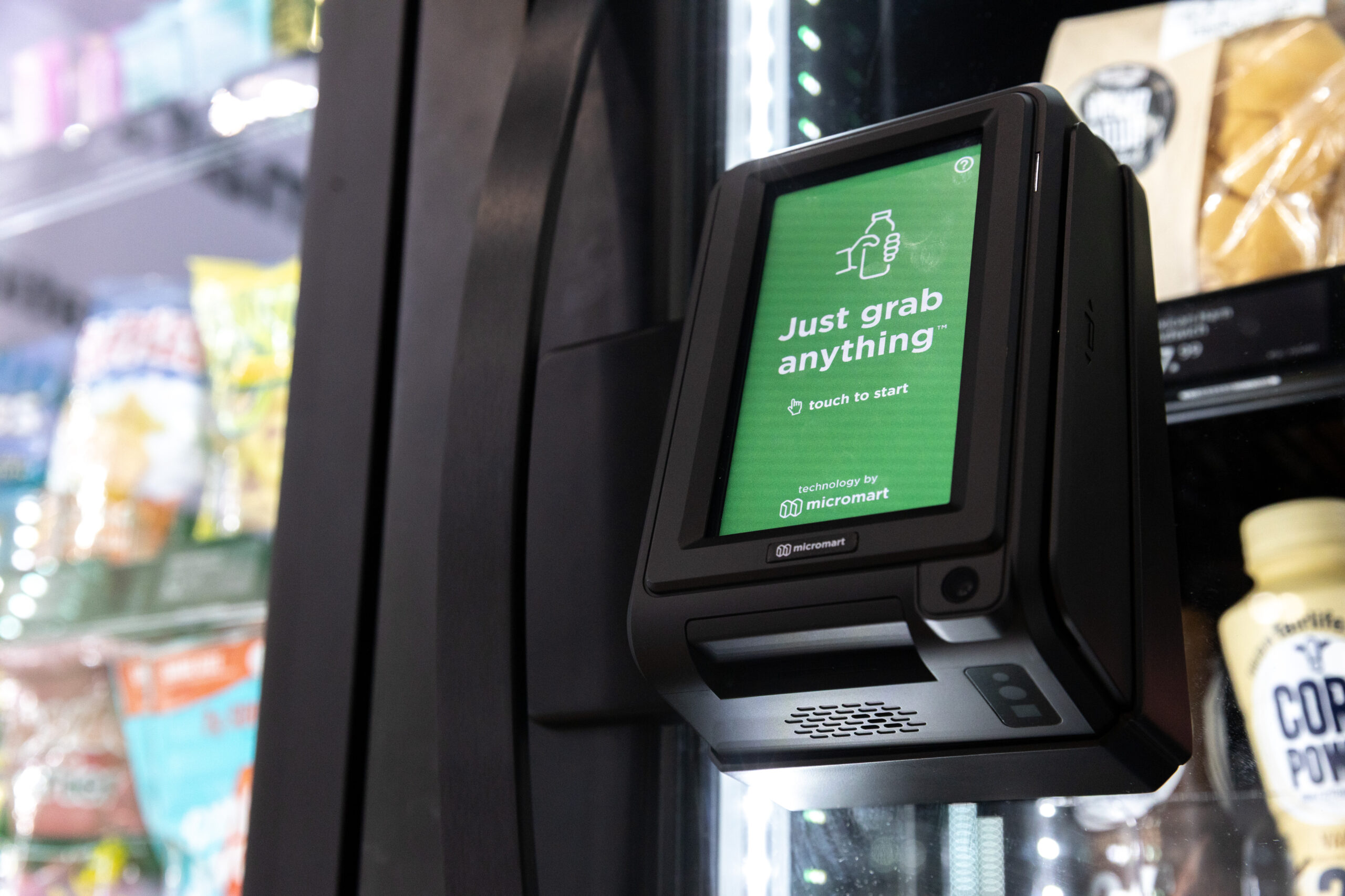 Self-service point-of-sale screen on a smart cooler
