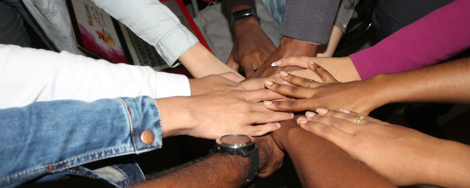person wearing silver ring and white long sleeve shirt